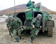 Serbian soldiers wearing their woodland uniforms
