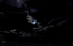 Moon peeking through thin cloud