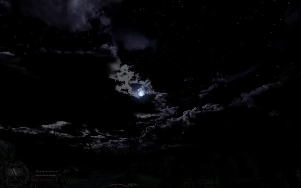 Moon peeking through thin cloud