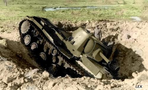 KV tank toppled into a crater made by a bomb