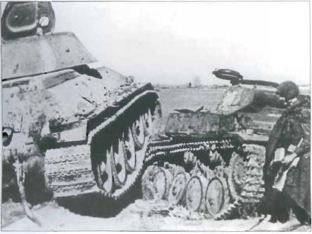 Russian T34 attempting to run over a German tank..