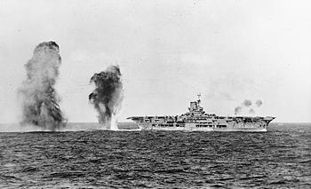 Aircraft carrier under artillery barrage