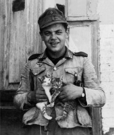 A Nazi holding Kittens!!! Daww, how cute!
