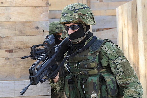 Croatian soldier helmet and assault rifle