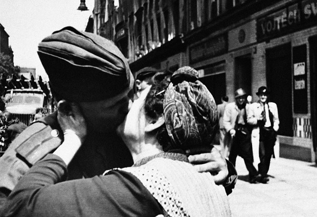 Czech mother kisses a Russian soldier in Prague