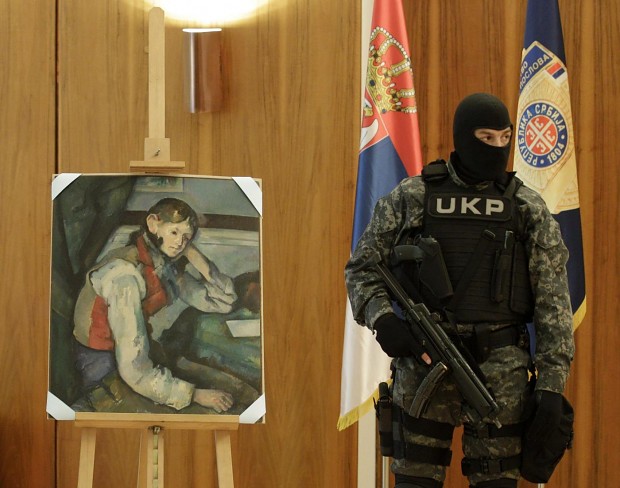 Serbian Police Member near picture of P. Cezanne