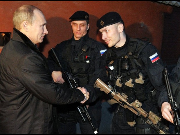 Putin shakes hands with the members of FSB