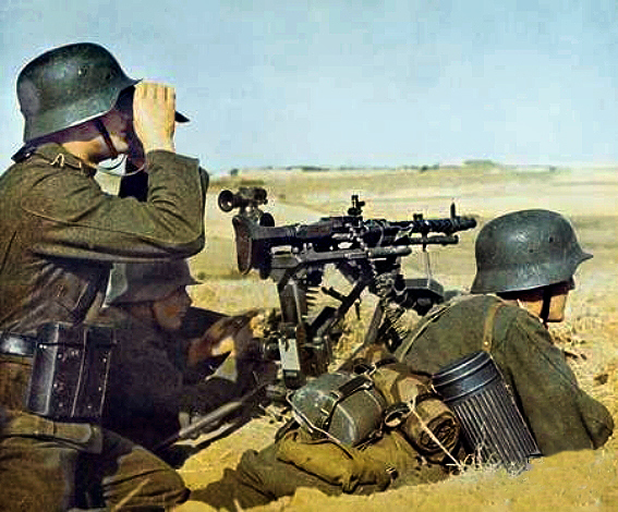 An NCO of a German infantry team surveys the battlefield through his binoculars